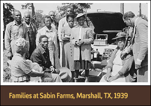 10 African American men and women wait as seated woman receives treatment from a doctor.