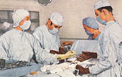 Two White male doctors and two White female nurses in the middle of an operation.