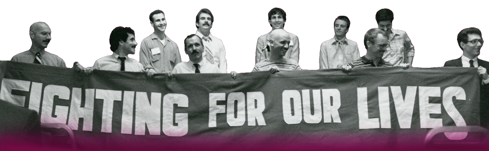 Group of 11 men, holding a banner with white lettering that reads “Fighting for our Lives.”