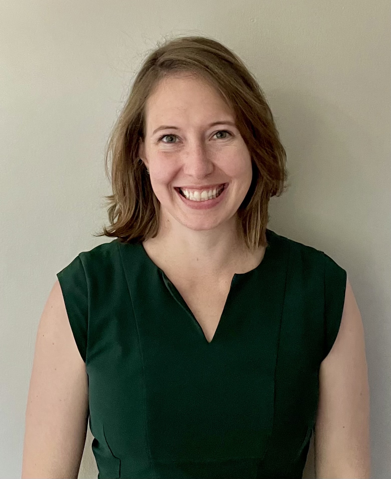 Photograph of a woman wearing a green shirt