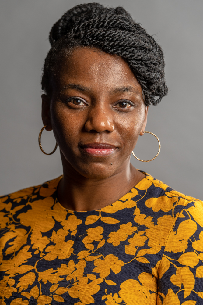 Photograph of a woman wearing an abstract patterned shirt