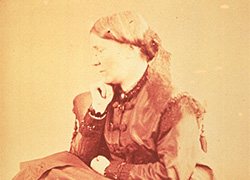  A formal black and white photographic portrait of a white woman.